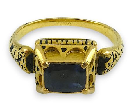 An antique high carat gold, black enamel and later? collet set cushion cut sapphire set 'poison' ring, the stone set in a rai