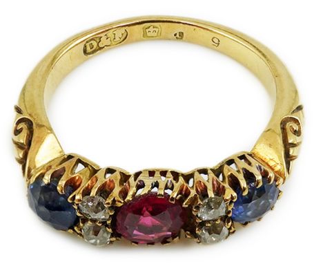 An early 20th century gold, ruby, sapphire and diamond cluster set half hoop ring, size J, gross weight 3.8 grams.  Chip to t