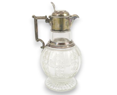 A late Victorian silver mounted cut glass claret jug, by Edward Hutton, with angular handle and hobnail cut decoration, Londo