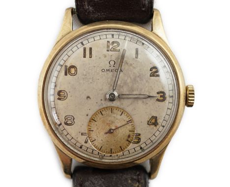 A gentleman's early 1940's 9ct gold Omega manual wind wrist watch, with Arabic dial and subsidiary seconds, movement c.30T2, 