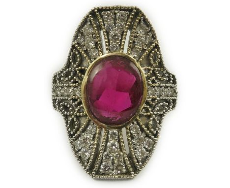 A gold, cabochon ruby and diamond cluster set upfinger ring, in a 'filigree' setting, size N, gross weight 11 grams.  A few s