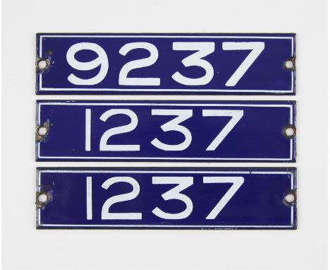 Set of London Underground enamel stock-number plates, from 1959. One matching pair (1237) and no. 9237. (3). Provenance: The 