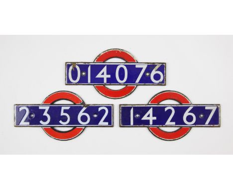 Set of London Underground enamel 'bull's eye' stock-number plates. Nos. 014076, 14267, 23562. (3). Provenance: The vendor wor