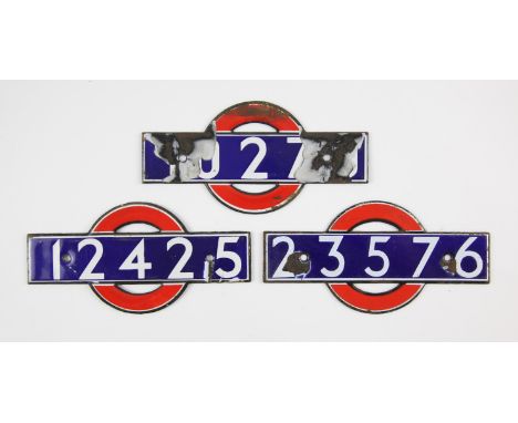 Set of London Underground enamel 'bull's eye' stock-number plates. Nos. 12425, 23576, and '...27...' (very badly damaged) (3)