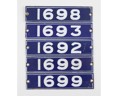 Set of London Underground enamel stock-number plates. Central Line 1962. Comprising one matching pair (1699), nos. 1692, 1693