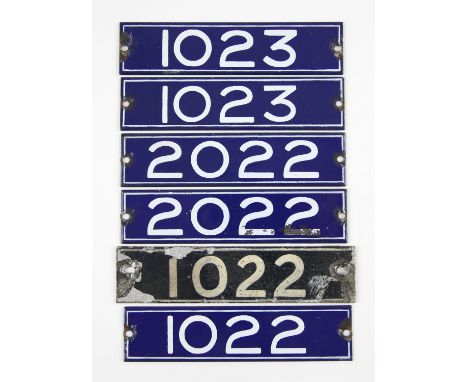 Set of London Underground enamel stock-number plates from 1959. Three matching pairs (1022, 1023, 2022). (6). Provenance: The
