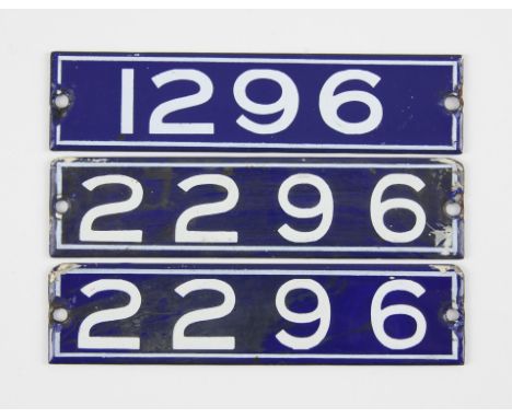 Set of London Underground enamel stock-number plates, from 1959. Matching pair (2296) and 1296. (3). Provenance: The vendor w