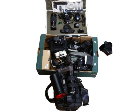 A group of various cameras, including an Olympus OM2, with a Tameron tally macro lens, and 2 others, cased, an Olympus OM10, 