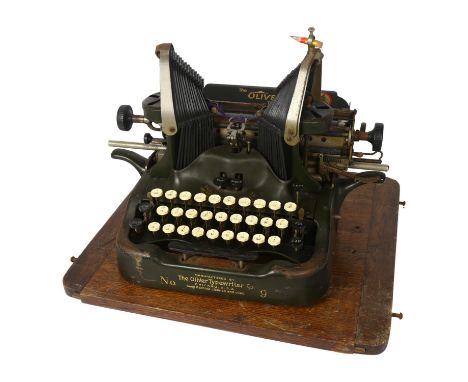 An early 20th century Oliver typewriter, on oak stand, with case 