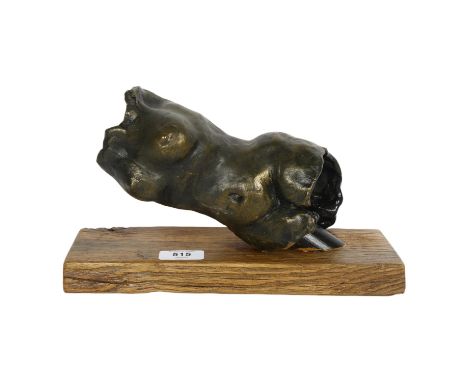 A bronze patinated ceramic torso sculpture, on oak plinth, overall L28.5cm 