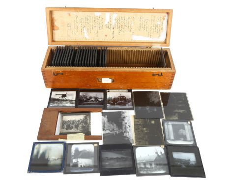 A box of Antique glass magic lantern slides, slides have maker's tag Newton & Co Ltd, 42 Museum Street London, slides are var