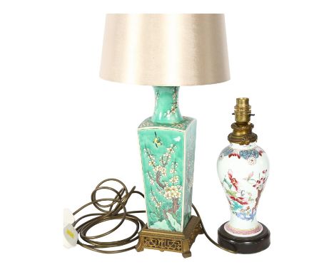 An Oriental porcelain green ground table lamp, with enamelled decoration, and shade, 51cm, and a smaller Chinese lamp with en