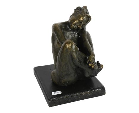 A bronzed ceramic sculpture of a nude seated figure, on painted wood plinth, H23cm 