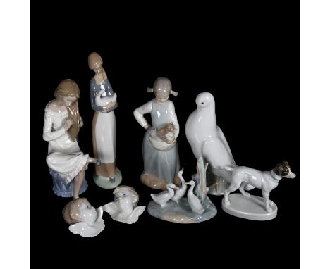 A group of porcelain figures, including a NAO dove, H20cm, Lladro angels etc 