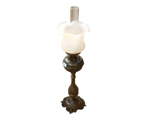 A Victorian embossed brass oil lamp with chimney and shade, H78cm 