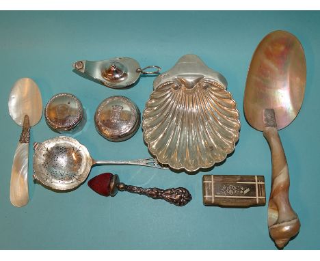 A silver table lamp in the form of an Aladdin's lamp, 9.5cm, marks rubbed, a silver scallop-shaped dish, London 1917, other s