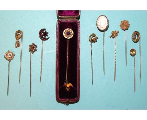 A lapis lazuli and pearl cluster stick pin with detachable head and lapel fitment, (boxed) and ten various stick pins, (11). 