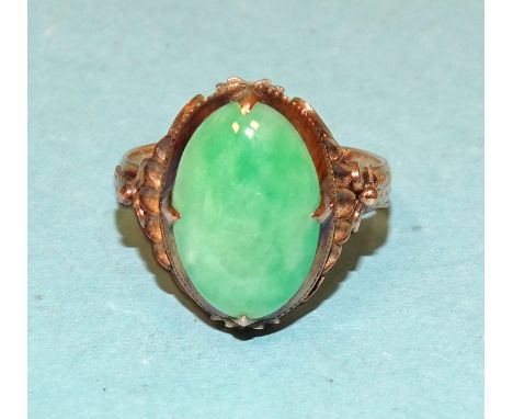 A 14k gold ring set oval jade cabochon, size K½, 3.8g, (boxed). 