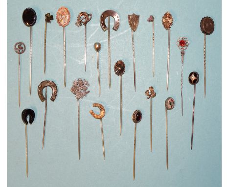 A collection of silver and white metal stick pins, including one set a micro-mosaic insect, a locket-back example and a shamr