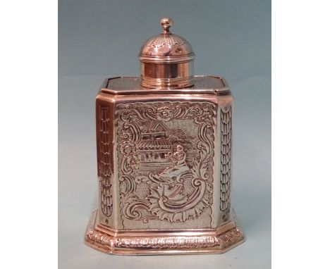 A George I silver tea caddy of upright rectangular form, with canted corners and later Rococo decoration, with sliding top an