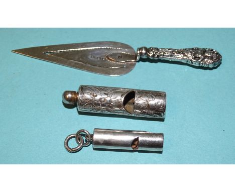 A silver trowel bookmark, Birmingham 1898 and two small silver whistles, 29mm and 40mm, Birmingham 1895 and 1899, (3). 