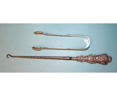 A pair of silver fiddle pattern sugar tongs, Reid &amp; Sons, Newcastle 1848 and a late-Victorian silver-handled button hook,