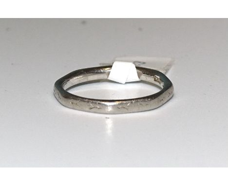 A platinum wedding band, size K, 3.4g. 