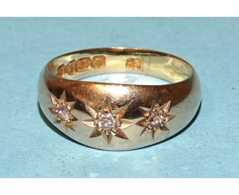 An early-20th century 18ct gold gipsy ring set three brilliant and 8/8-cut diamonds, size K½, 4.4g. 