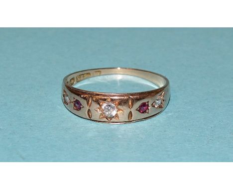 A 15ct gold gypsy ring set three diamonds and two rubies, size K, 1.8g. 
