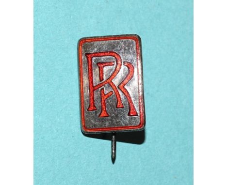 A Rolls Royce hallmarked silver lapel badge with red enamel RR logo, by J R Gaunt &amp; Son, numbered 6267, Birmingham 1971, 