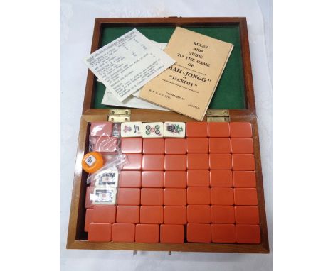 A vintage Mahjong set by Jackpot, contained in original carved wooden box