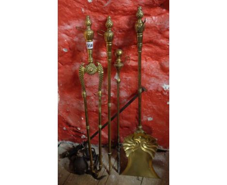A set of Victorian fire irons - sold with an associated poker and a cast iron bar scale