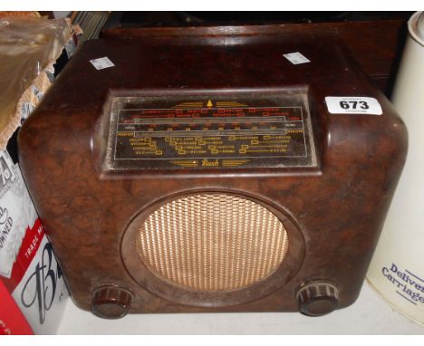 A vintage Bush DAC90A Bakelite radio in brown finish