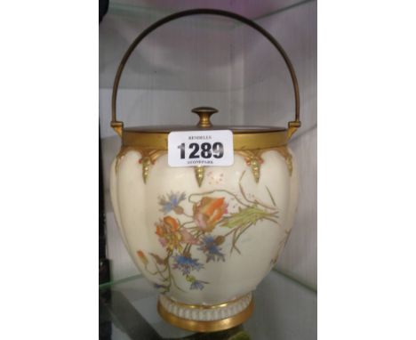 A late 19th Century Royal Worcester porcelain biscuit barrel of lobed form with hand painted floral sprays on an ivory ground