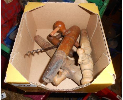 A box containing a quantity of vintage wooden barrel taps, etc.