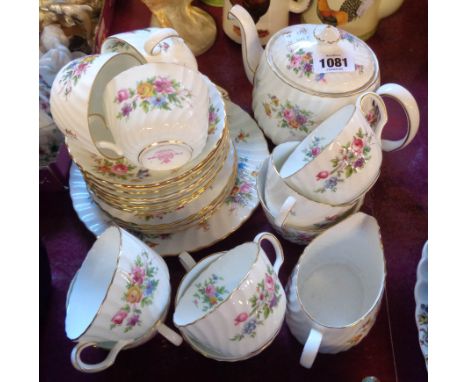 A Minton bone china tea set in the Marlow pattern comprising teapot, cream and sugar, four trios, three cups and saucers, bre