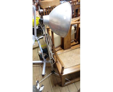 A vintage Photax metal photography floor lamp with adjustable stem, set on tripod base