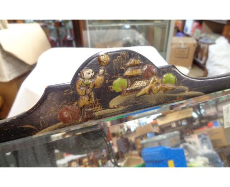 An old easel mirror with black lacquered Chinoiserie decoration and bevelled plate