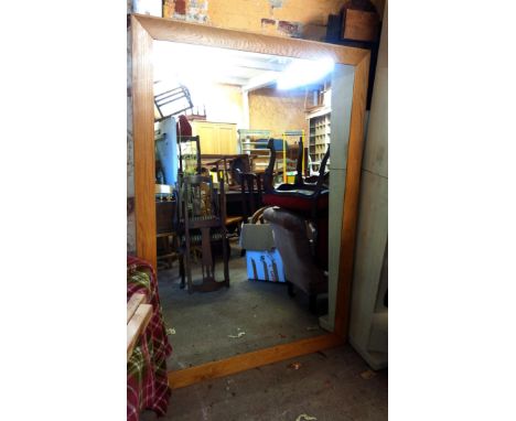 A large modern oak framed oblong wall mirror - 1.72m X 1.23m