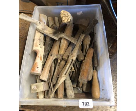 A crate containing a quantity of tools including spoke shaves, chisels, etc.