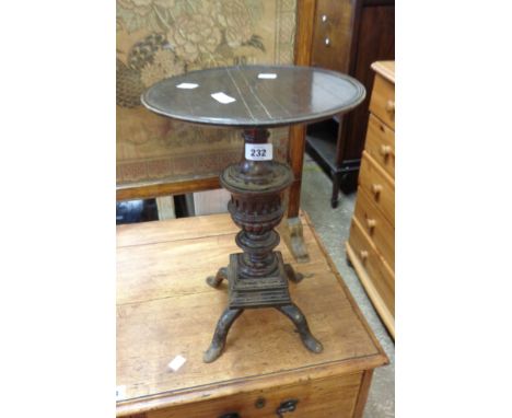 An adapted late Georgian mahogany pedestal wine table with later ornate pillar support