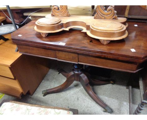 A 92cm late Georgian mahogany fold-over swivel-top card table with canted corners, set on turned pillar and quadruple reeded 