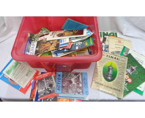 A red crate containing a collection of late 1950's, 1960's, 1970's and later football programmes including Tottenham Season 1