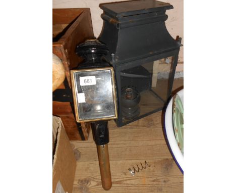 A Victorian carriage lamp of metal and brass construction with bevelled glass panels - sold with a modern wall lamp of metal 
