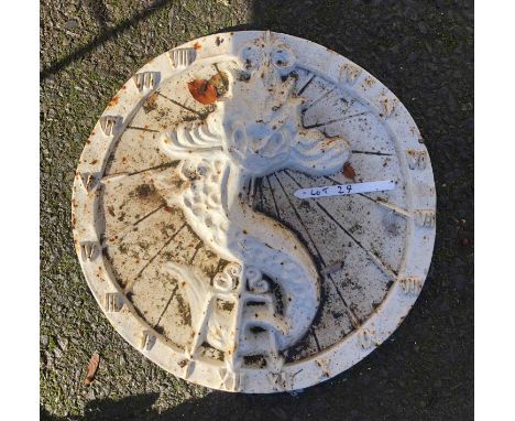 A modern painted cast iron sundial with grotesque fish design