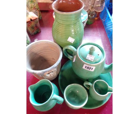 Six pieces of C.H. Brannam pottery including teapot, jugs, etc. - sold with a small studio pottery jardiniere with figural mo