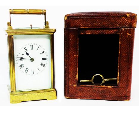 A late Victorian brass and bevelled glass cased carriage clock with eight day strike repeat movement (bearing 1896 presentati