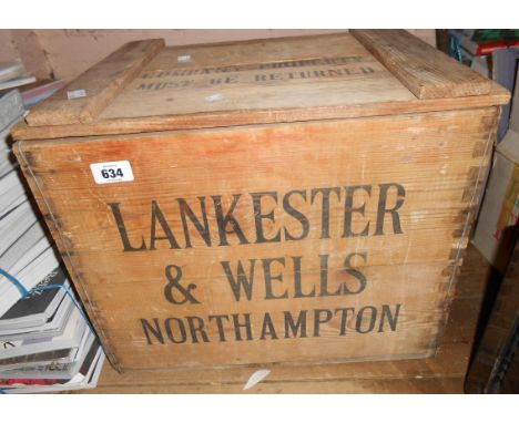 An old Laird Scotch Whisky advertising crate with lift-top and bottle fitted interior