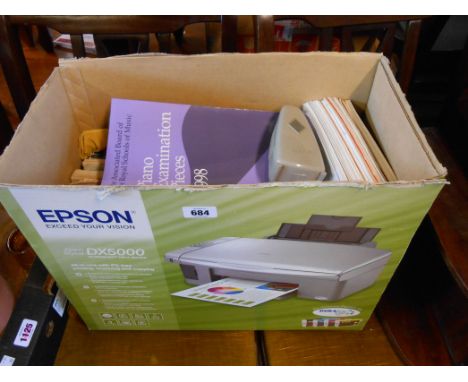 A box containing two recorders, a metronome and a large quantity of sheet music