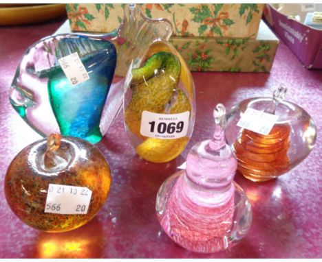 Five glass paperweights of assorted form with internal enamel decoration